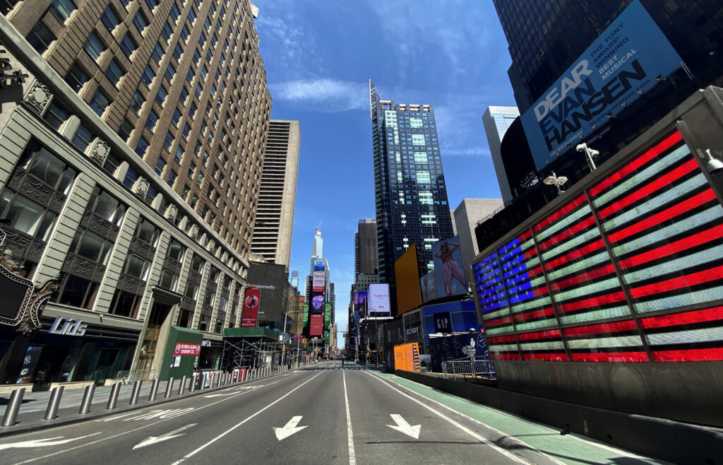 a nearly deserted 7th avenue in times square is seen near midday during outbreak of the coronavirus disease (covid 19) in new york
